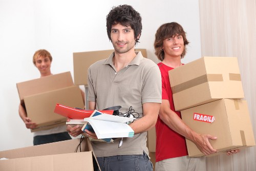 Careful loading of unwanted furniture during a local pick-up