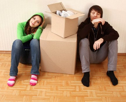 Packed boxes and furniture ready for removal van transport