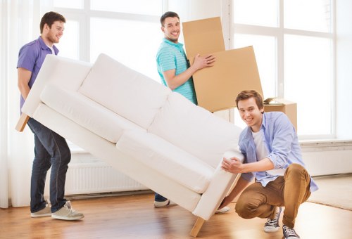 Packed household items being loaded for a move in Watford