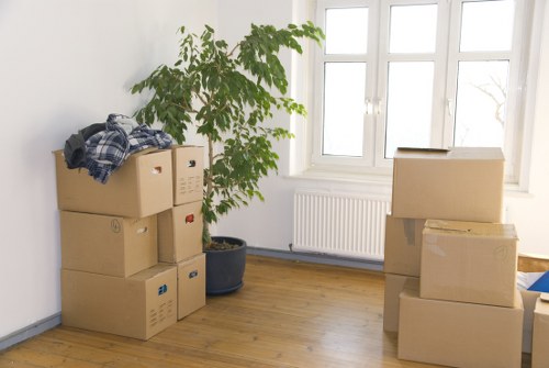 Removal van and packing boxes prepared for a home move in Watford