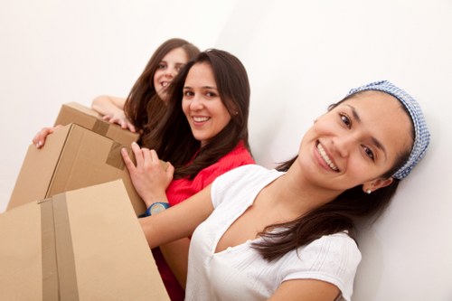 Protected movers preparing to load items carefully