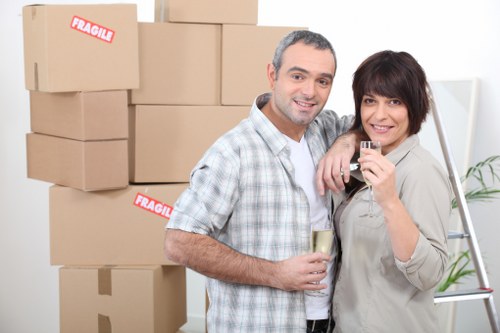 Professional movers handling boxes and furniture safely