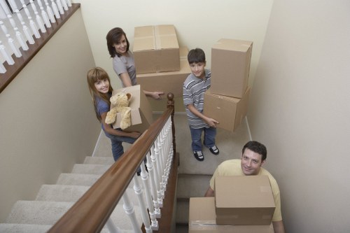 Removal professionals loading furniture carefully for transport